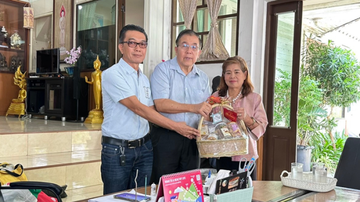 Giving a New Year 2025 wish basket to the director of Pinmonthon Technological College